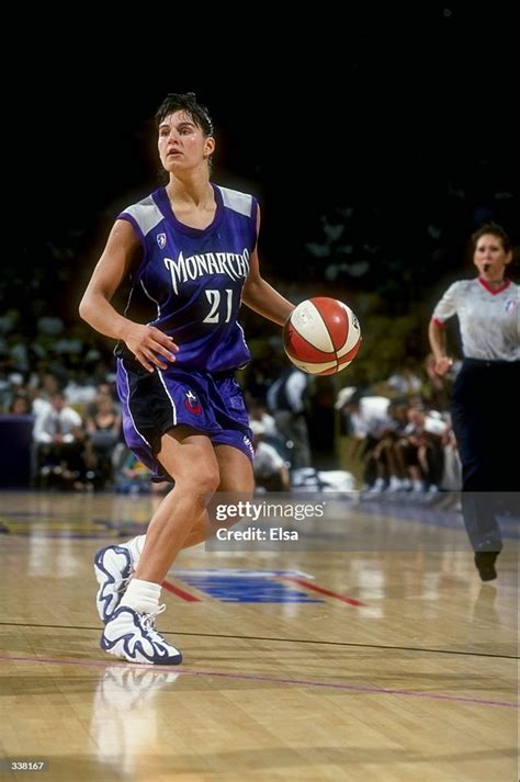 Ticha Penicheiro of the Sacramento Monarchs dribbles the ball down ...