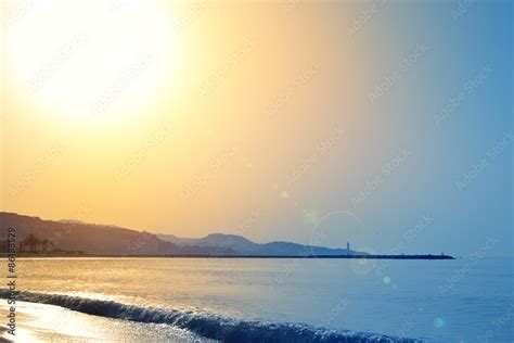 Sunrise on the beach Stock Photo | Adobe Stock