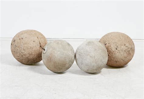 Lot - Four stone garden spheres