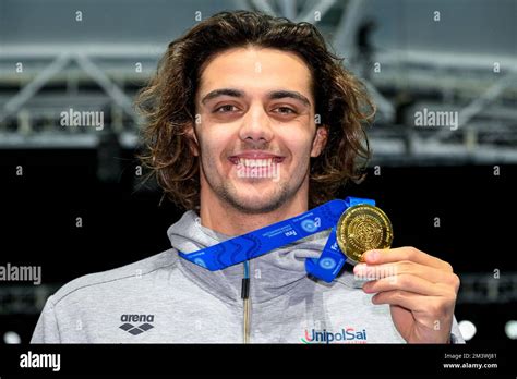 Thomas Ceccon of Italy shows the gold medal after compete in the 100m Individual Medley Men ...