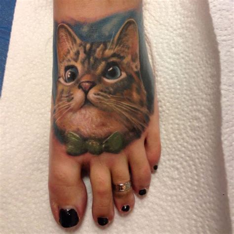 Cat tattoo on foot - Tattooimages.biz