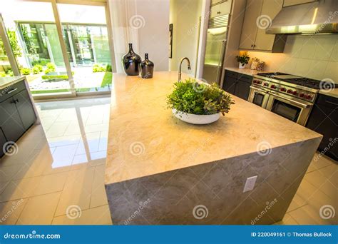 Kitchen Granite Counter Island in Modern Home Stock Image - Image of home, cabinets: 220049161