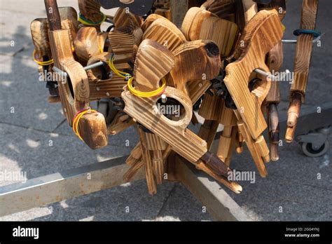 The wooden toy guns with rubber bands in the rack outdoors Stock Photo ...