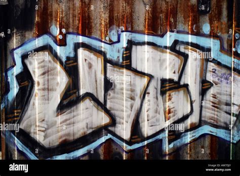 Graffiti on a metal wall Stock Photo - Alamy