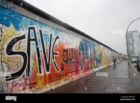 The Berlin Wall at the East Side Gallery, "Save Our Earth" graffiti, Germany Stock Photo - Alamy