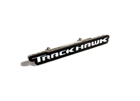 a black and white sticker with the word trackhawk on it's side