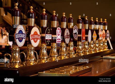 A line of beer taps on the bar of an Edinburgh pub, Scotland Stock Photo: 68723742 - Alamy