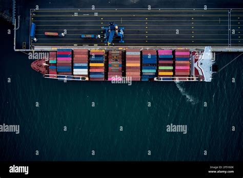 Cargo ship with containers in port Stock Photo - Alamy