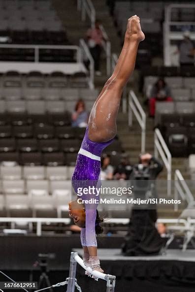 Simone Biles of World Champions Centre warms up on the uneven bars at ...