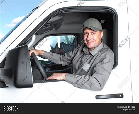 Smiling truck driver in the car. Delivery cargo service. Stock Photo & Stock Images | Bigstock