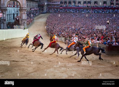 The Palio di Siena horse race on Piazza del Campo, Siena, Tuscany ...