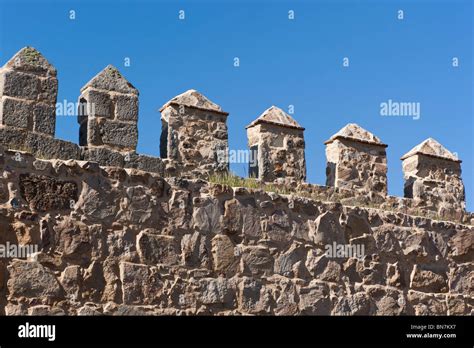 Avila, Avila Province, Spain. Detail of city fortifications. Battlement or crenelation along ...