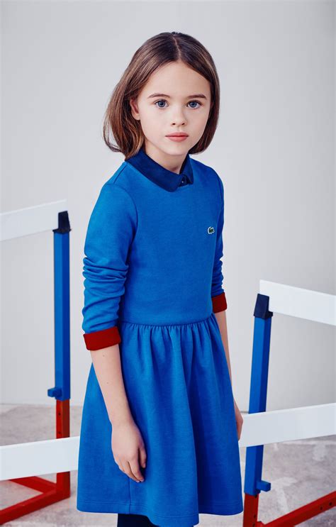 Back to school looks like fun in this bold blue dress by Lacoste ...