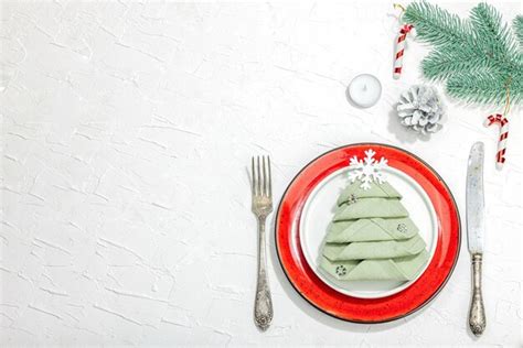 Premium Photo | Christmas table setting new year cutlery traditional winter decor flat lay ...