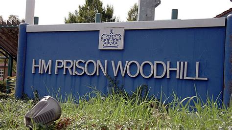 HMP Woodhill prison officer charged over inmate death - BBC News