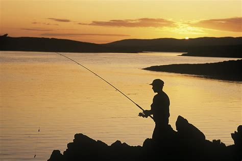 Silhouette Of A Fisherman Fishing On Photograph by The Irish Image Collection