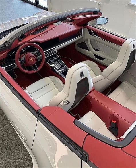 the interior of a red and white sports car