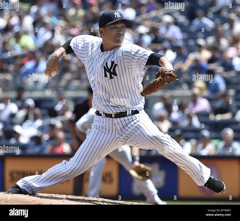 Photo shows New York Yankees starter Masahiro Tanaka pitching during a ...