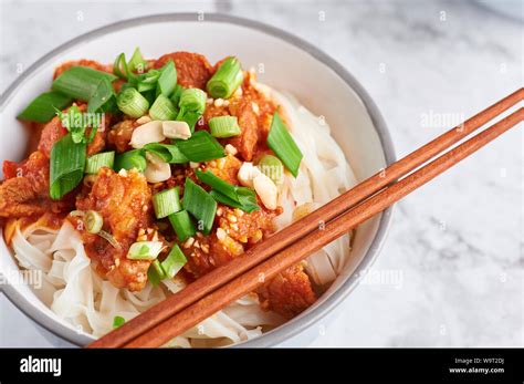 shan noodles with chopsticks at white marble tabletop. burmese cuisine ...