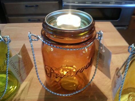 Kirkland store mason jar...turn a small mason jar lid upside down to hold tea light candle so ...