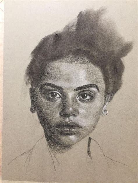 a pencil drawing of a woman's face with her hair pulled back in a bun