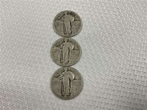 Three walking liberty quarters - Legacy Auction Company