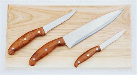 knife on an wooden cutting board 6782337 Stock Photo at Vecteezy