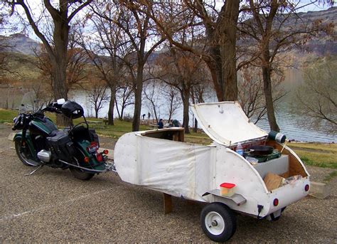 Tiny Motorcycle Camper Transforms From Storage Trailer To Teardrop-Like Sleep Space