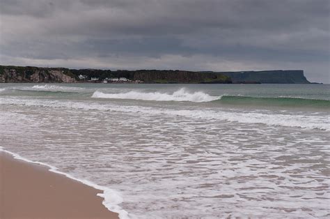 View Of Antrim Coast Beach, Sea And Cliff In Lreland, Uk Photograph by ...