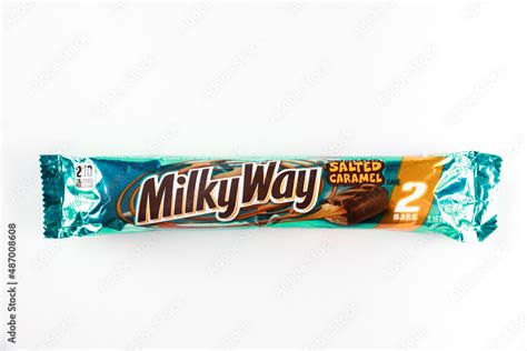 Milky Way milk chocolate bar with salted caramel on white background ...