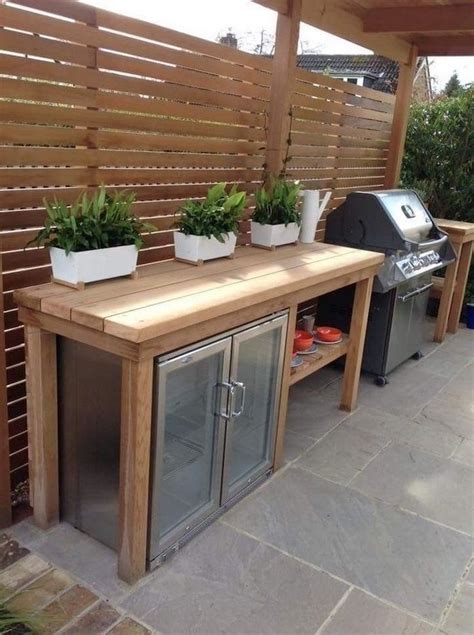 outdoor kitchen ideas wooden table with fridge and barbecue grill three ...