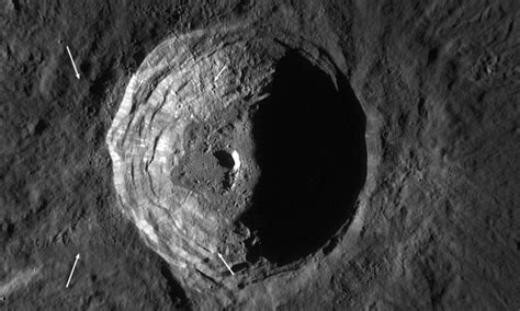 Lunar orbiter captures close-up views of two-mile-deep crater on moon ...