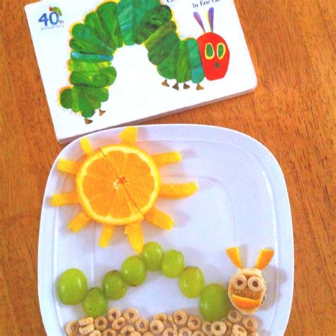 The Very Hungry Caterpillar breakfast (grapes cut in 1/2, orange slices/peel, Cheerios, fig ...