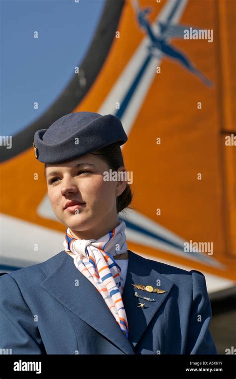Air hostess in traditional fifties uniform standing alongside an old Stock Photo, Royalty Free ...