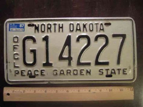 NORTH DAKOTA TRIBWAR PAIR Vanity expired license plate