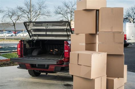 Premium Photo | Moving boxes ready to be loaded into the pickup truck