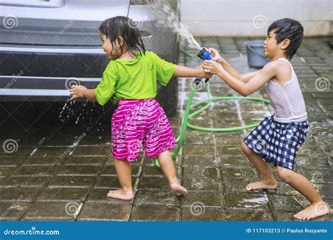 Adorable Children Playing with Water Splashing Stock Image - Image of ...