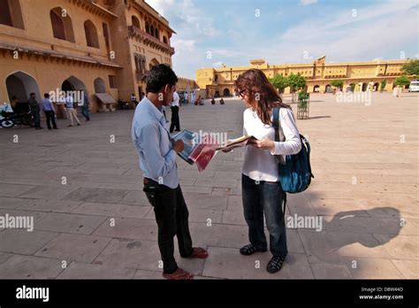 local selling postcards to western tourist inside Amer Fort in Amer ...