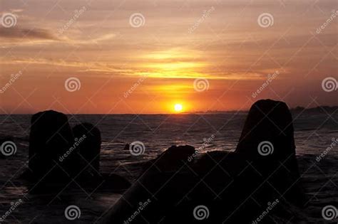 Sunset and Breakwaters at Glagah Beach, Yogyakarta, Indonesia Stock ...