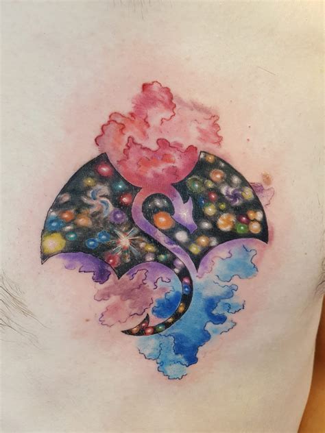 My first tattoo, a space dragon in the middle of my chest. Done by ...