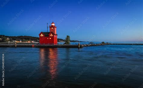 Holland Michigan Lighthouse At Night. The beautiful big red lighthouse at Holland State Park at ...