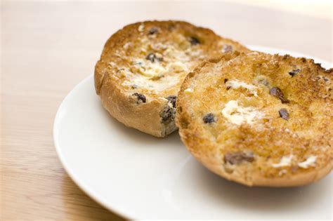 Buttered, toasted teacake on white plate - The Palace Fun Centre