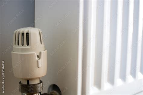 Thermostatic valve on radiator turned to highest number 5, close up ...