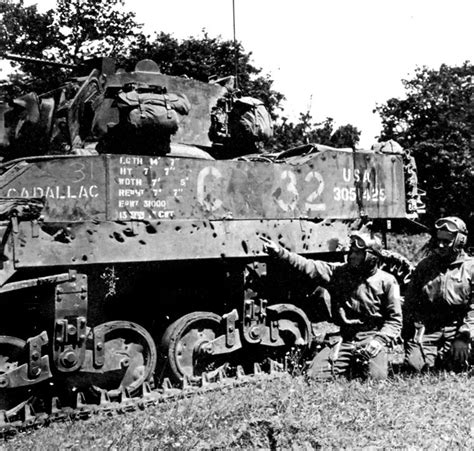 U.S. crewman points to his tank's damage | History war, Tank armor, Damaged tanks