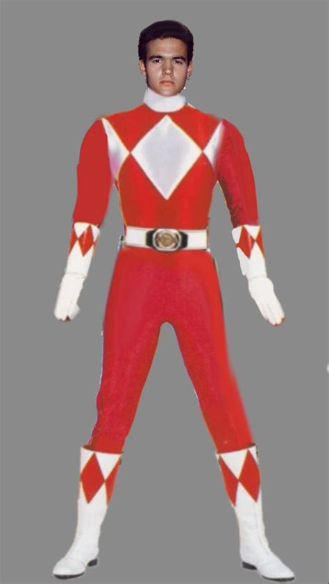 a man in a red and white costume standing with his hands on his hipss