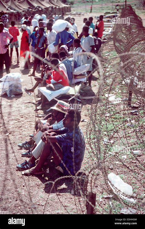 Haitian migrants wait at a temporary refugee camp after being interdicted at sea on their way to ...