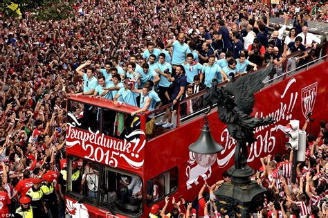 Thousands of Athletic Bilbao fans greet their side in open-top bus ...