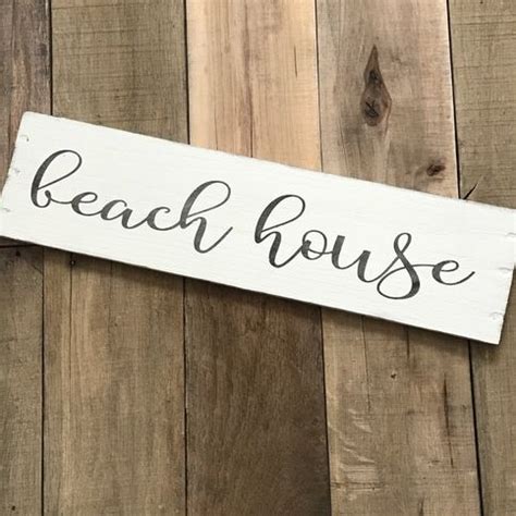 Beach House sign made from reclaimed wood. Measures approximately 20 x 6 in. Every sign is ...