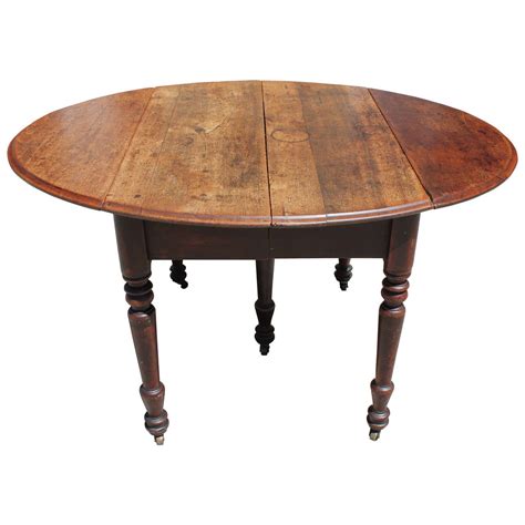 Early 19th Century Round Rustic Drop-Leaf Table at 1stDibs