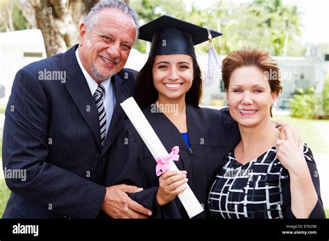 Hispanic Student And Parents Celebrate Graduation Stock Photo - Alamy